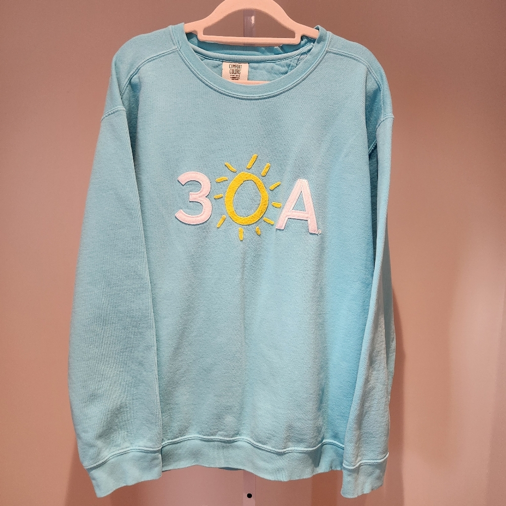 Light Blue Sweatshirt with Sun Embroidery